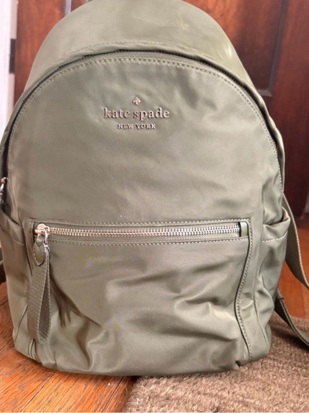 kate spade Olive Nylon Backpack with Front Zip Pocket with  leather wallet.
